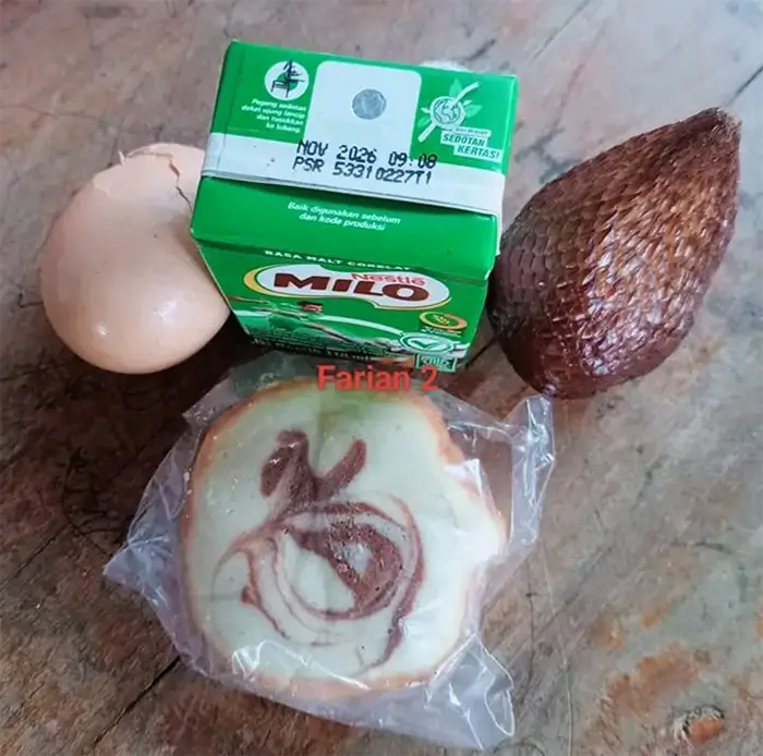 Menu telur setengah matang dan kacang polong keras yang disalurkan SPPG  Doridungga Kecamatan Donggo Kabupaten Bima yang dikeluhkan orang tua murid.