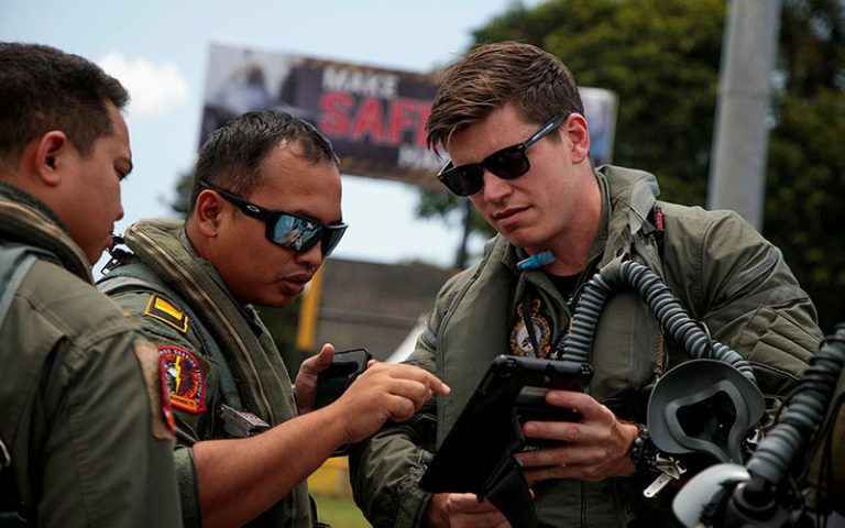 Flight Lieutenant Michael (right) discusses mission plans with Indonesian Air Force (TNI-AU) officer Captain Aditya Wahyu Budiarta before the first joint mission of Exercise Elang AUSINDO 2023 at Sam Ratulangi Air Force Base, Manado. Credits CPL Kieren Whiteley.