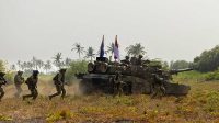 An Australian Army M1A1 Abrams Main Battle Tank conducts an amphibious assault during Exercise Keris Woomera 2024 at Banongan Beach, Indonesia. Photographer CPL Janet Pan.