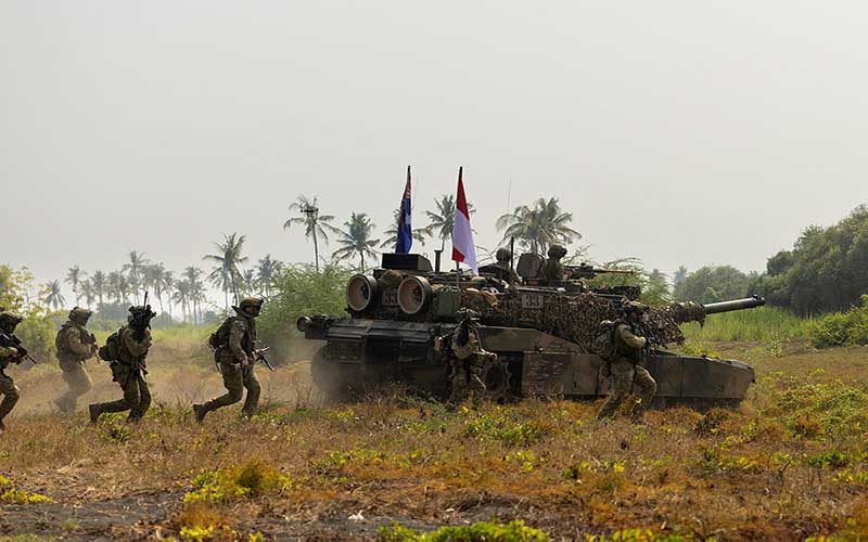 An Australian Army M1A1 Abrams Main Battle Tank conducts an amphibious assault during Exercise Keris Woomera 2024 at Banongan Beach, Indonesia. Photographer CPL Janet Pan.