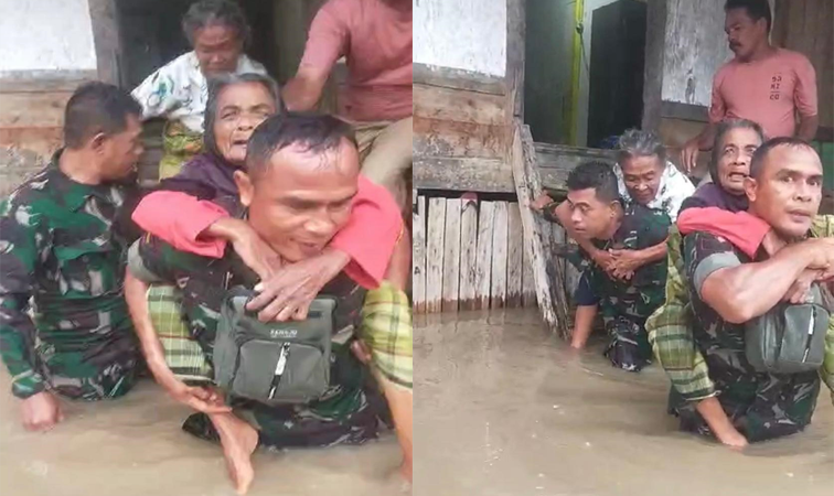 Anggota Koramil 1608-07/Monta Kodim Bima sigap menyelamatkan sejumlah lansia yang terjebak luapan banjir di Desa Sakuru Kecamatan Monta Kabupaten Bima, Senin (20/1/2025) sore.