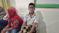 Idris bahagia setelah berhasil menjalani operasi tumor tanpa mengeluarkan biaya sepeserpun berkat Program Jaminan Kesehatan Nasional (JKN).