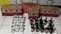 Barang bukti puluhan botol minuman keras berbagai merek yang diamankan Satuan Reserse Narkoba Polres Dompu.